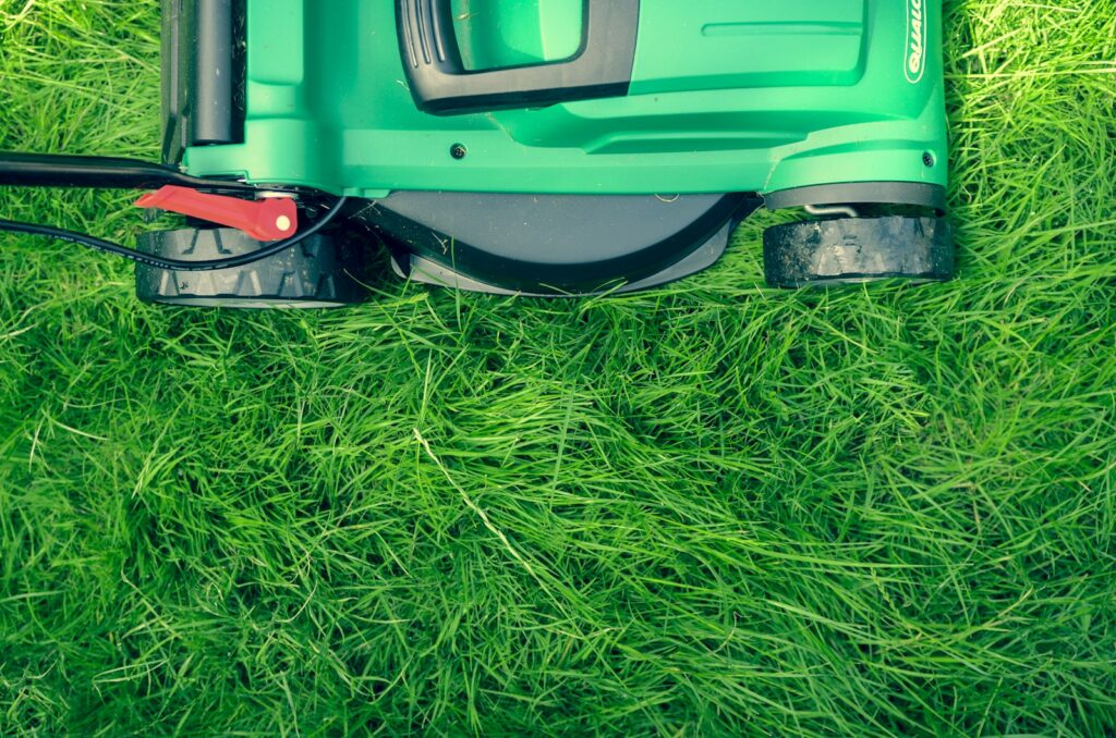 Fresh green lawn being mowed by Cordero Lawn Care in Hawthorne, NJ