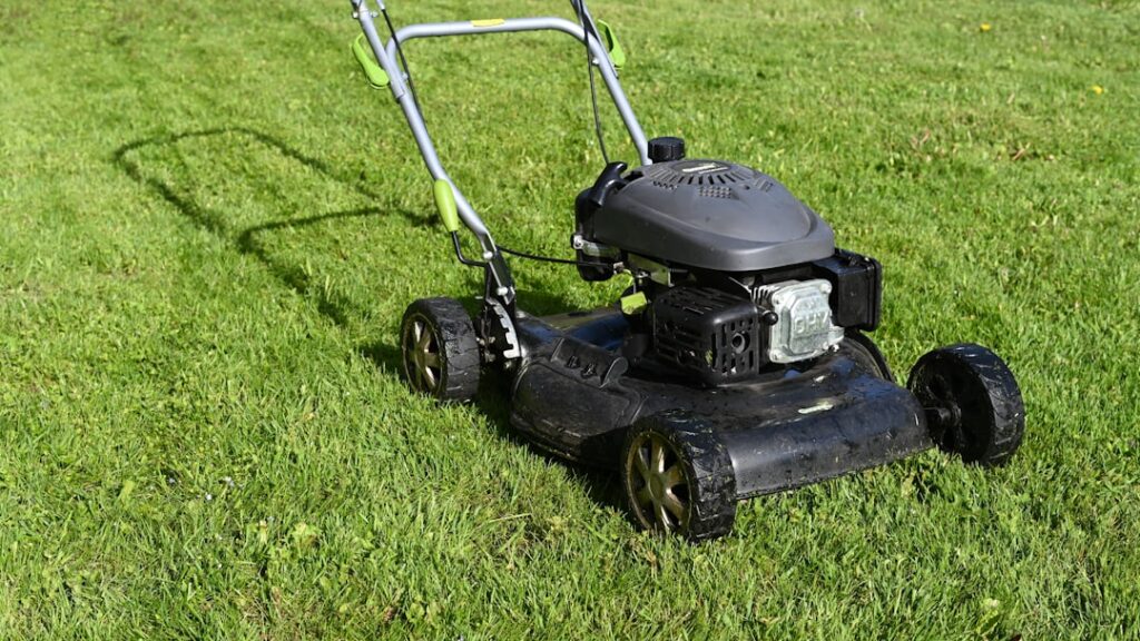 Lawn mower on a healthy green lawn